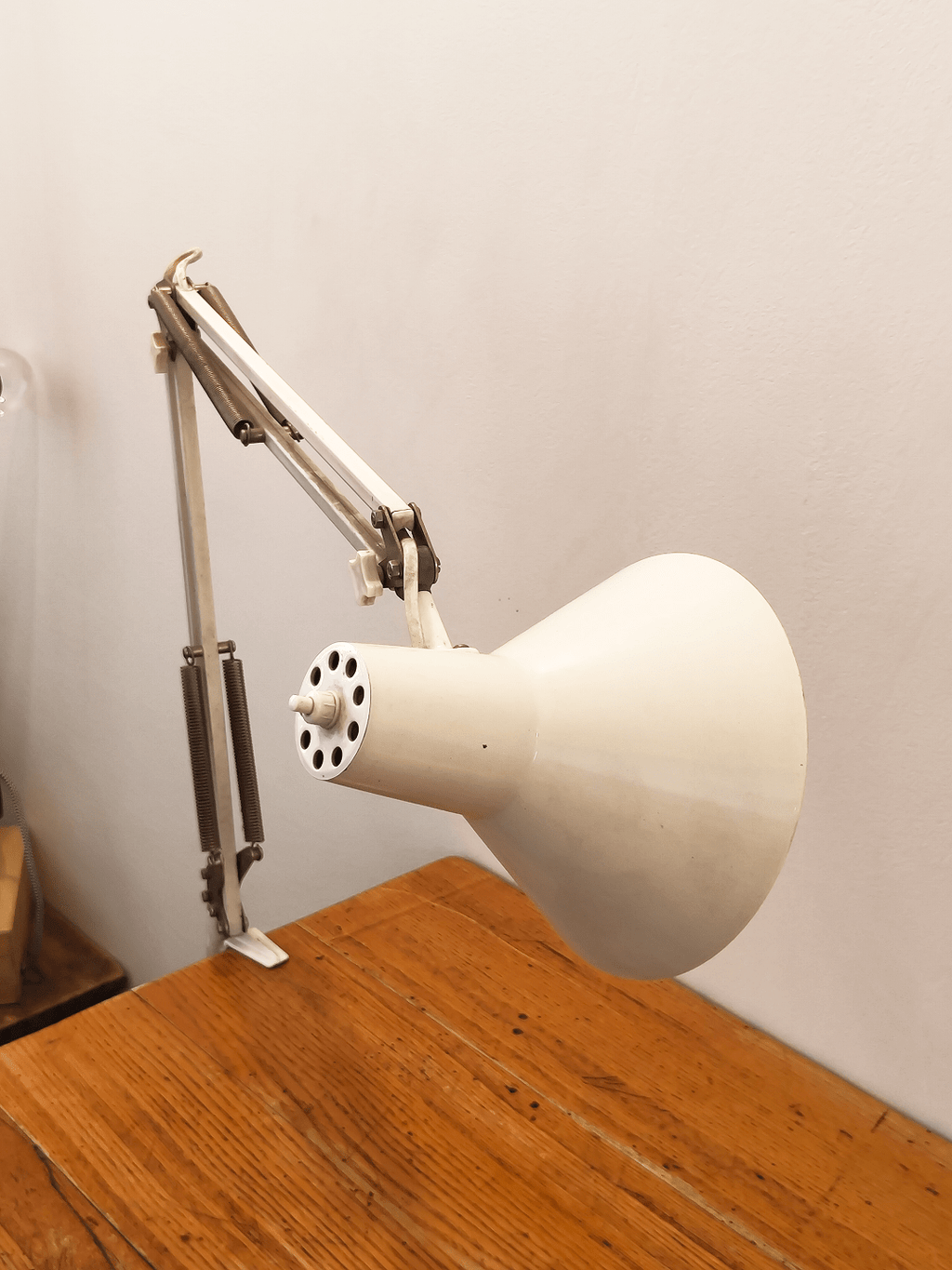 Detail of the perforated shade and arm - Articulated arm architect lamp